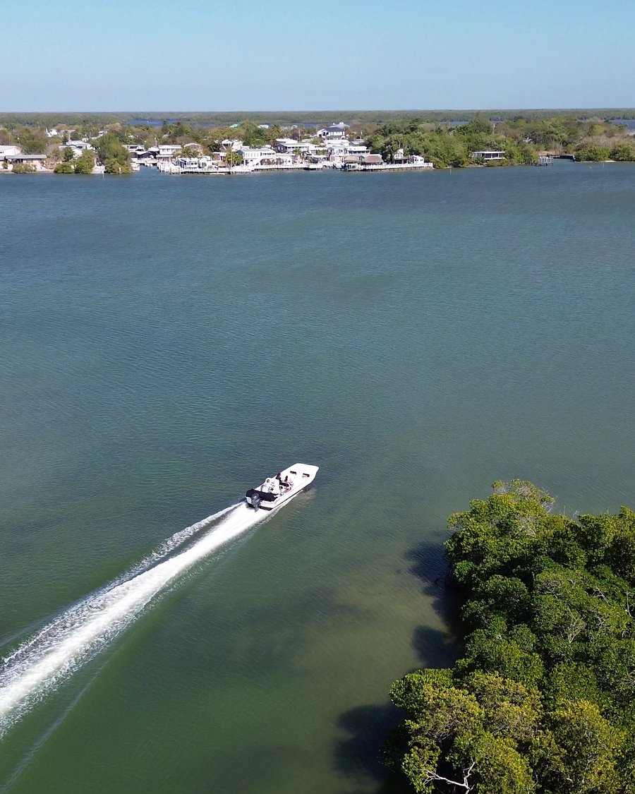 Aerial drone photo of a Smallwood Store boat tour on the water near Chokoloskee, captured by Premier Media Services